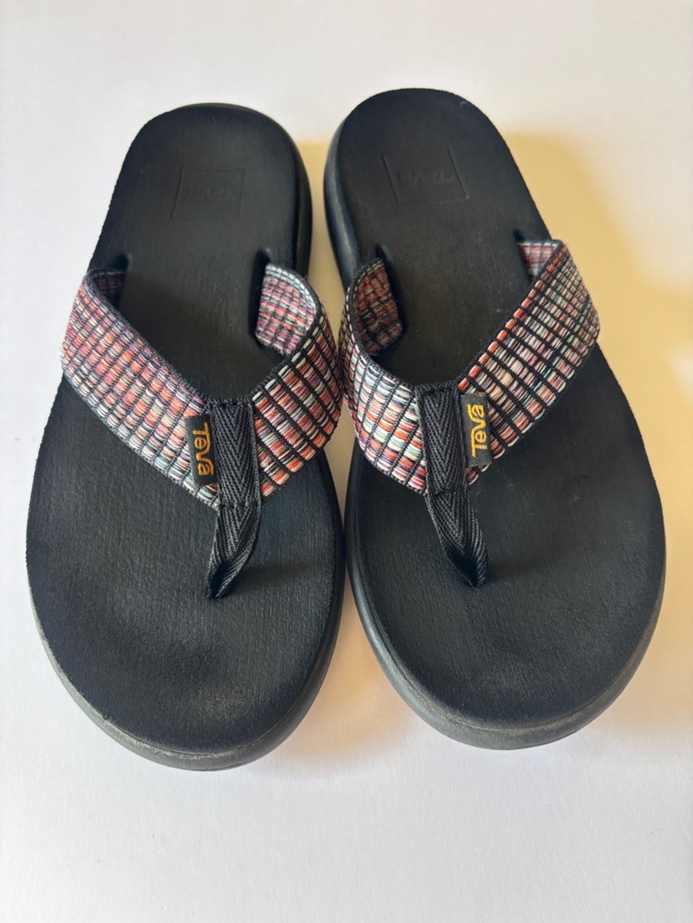 Teva Black Footbed Flip Flops with Red-Orange Patterned Straps